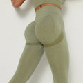 Green leggings with a plain background