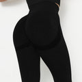 Black leggings worn by a person on a white background