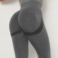 Gray leggings with black accents on a white background
